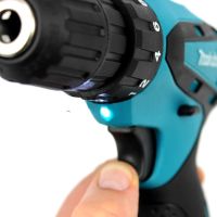 Makita DF330DWE rechargeable screwdriver 12V 2AH Li-Ion + spare battery in a case and a set of tools