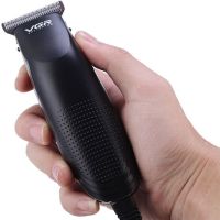 A set of two VGR V-023 2-in-1 rechargeable hair and beard clippers, a wired trimmer with a set of removable attachments in the V023 bag