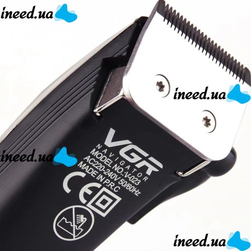 A set of two VGR V-023 2-in-1 rechargeable hair and beard clippers, a wired trimmer with a set of removable attachments in the V023 bag